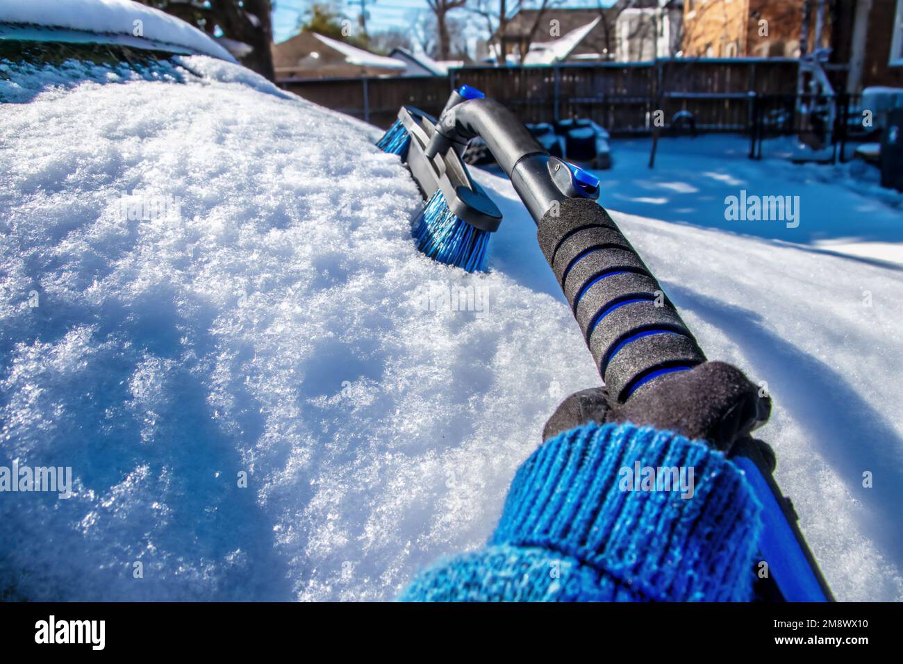 Cleaning snow off windshield perspective picture from point of view of