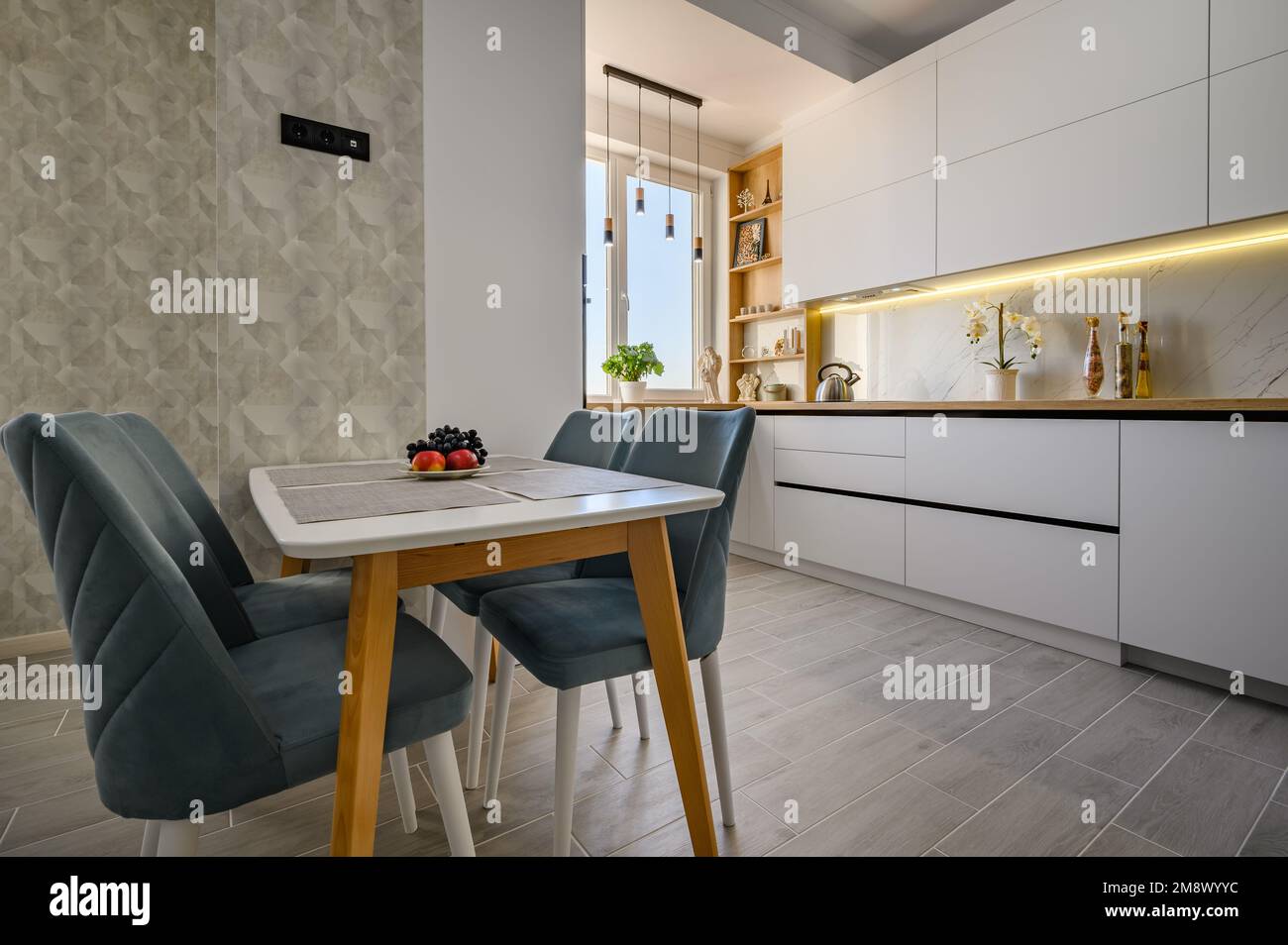 Modern and stylish white kitchen in studio apartment Stock Photo