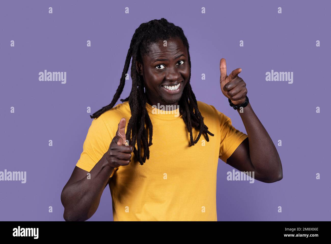 Charismatic handsome young black man pointing at camera Stock Photo