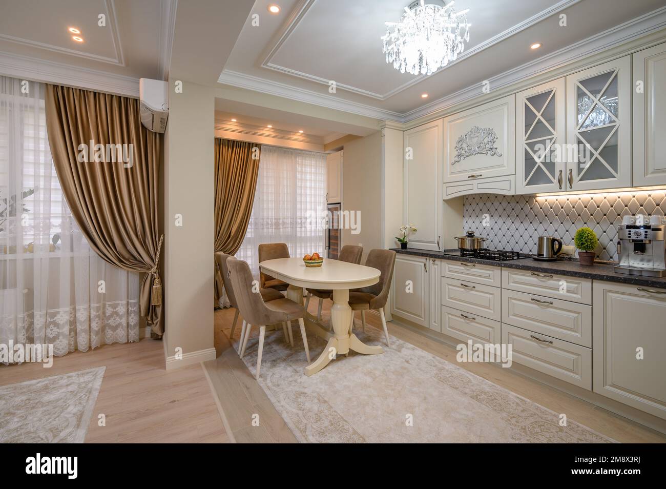 Classic beige kitchen with counter space and a variety of appliances ...