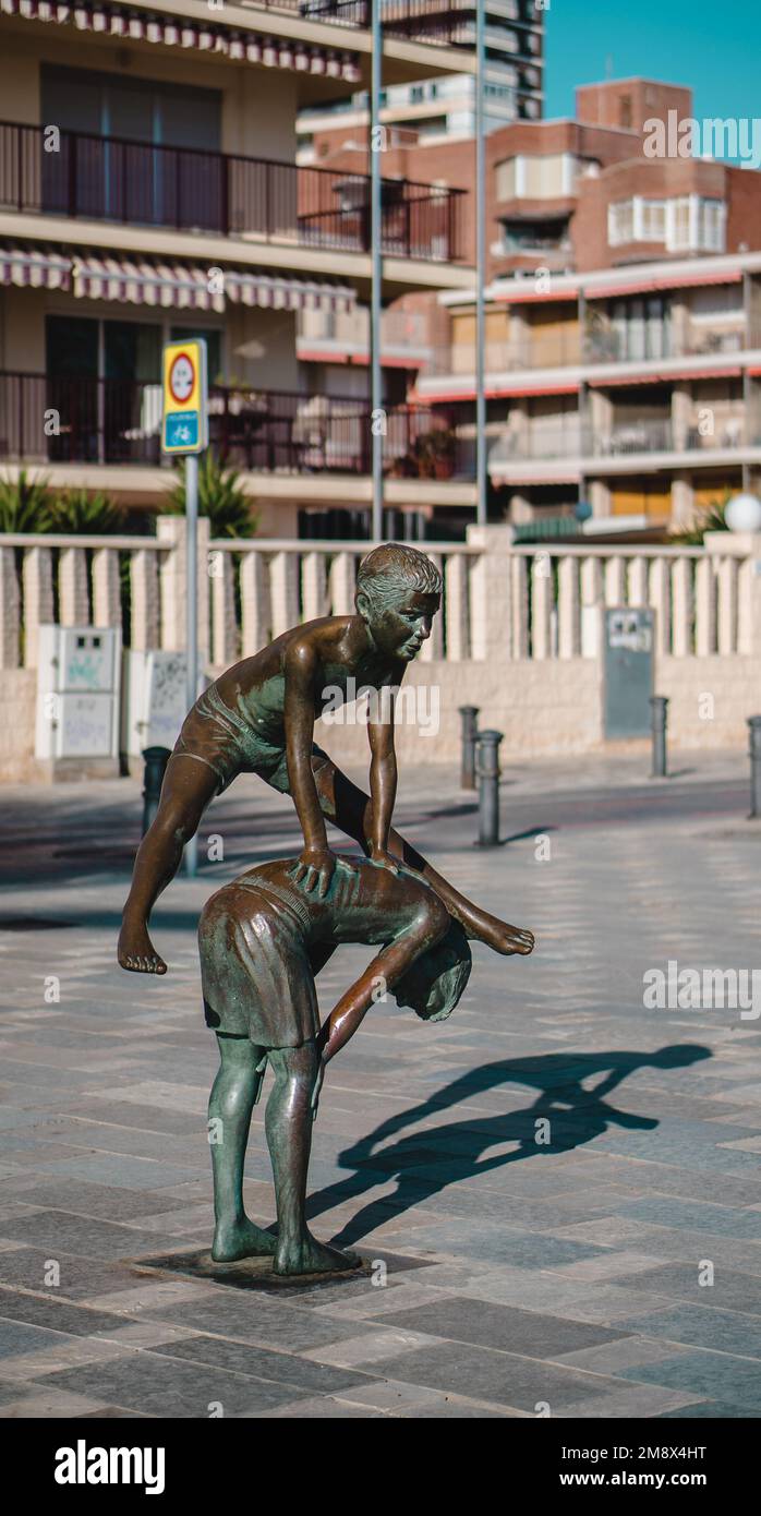 Boy's playing Leapfrog statue Stock Photo