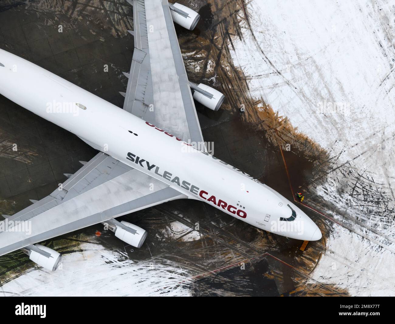Skylease cargo Boeing 747-400 aircraft parked at Anchorage Airport after snow. Four engines airplane 747-400F of Sky Lease Cargo after snow storm. Stock Photo