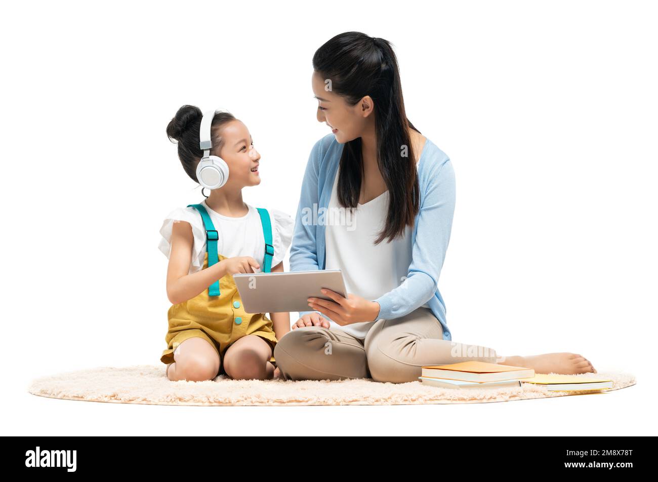 A young female teacher counseling students learning Stock Photo