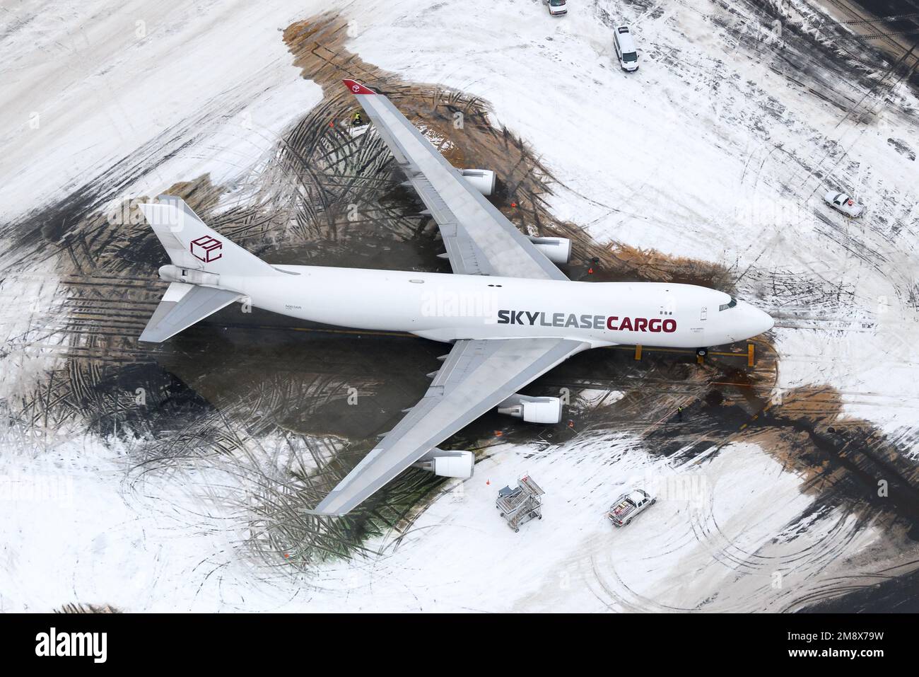 Skylease cargo Boeing 747-400 aircraft parked at Anchorage Airport after snow. Airplane 747-400F of Sky Lease Cargo after snow storm. Stock Photo