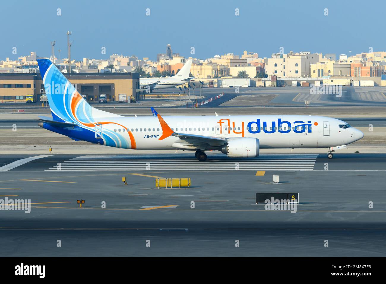 Flydubai Boeing 737 Max aircraft taxiing in Bahrain. Airplane of Dubai Aviation Corporation FlyDubai, a low cost airline. 737 MAX plane. Stock Photo