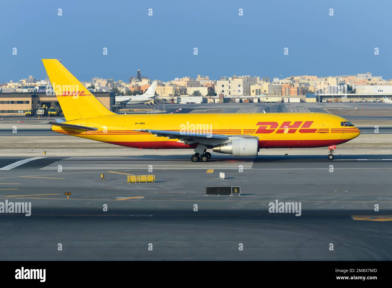 DHL Cargo airplane Boeing 767 taxiing. Transport of freighter on DHL Aircraft 767F, also refered as Boeing 767-200BDSF plane. Stock Photo