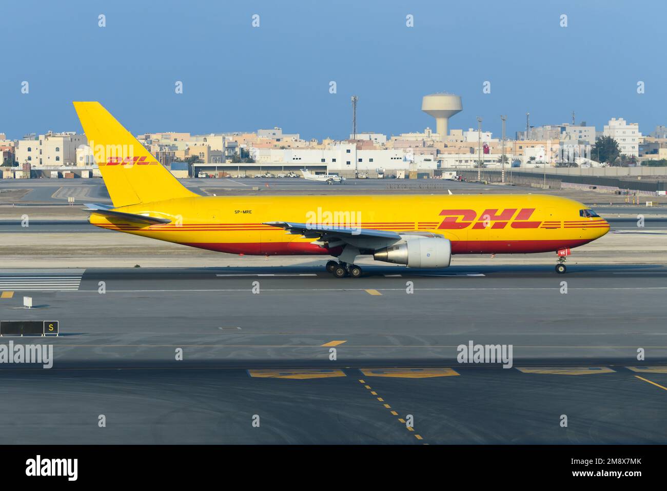 DHL Cargo Boeing 767 cargo aircraft taxiing. Transport of freighter on DHL airplane 767F, also refered as Boeing 767-200BDSF plane. Stock Photo