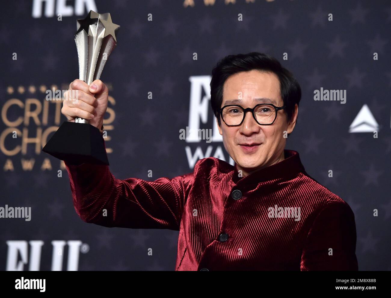 Ke Huy Quan poses with the award for best supporting actor for