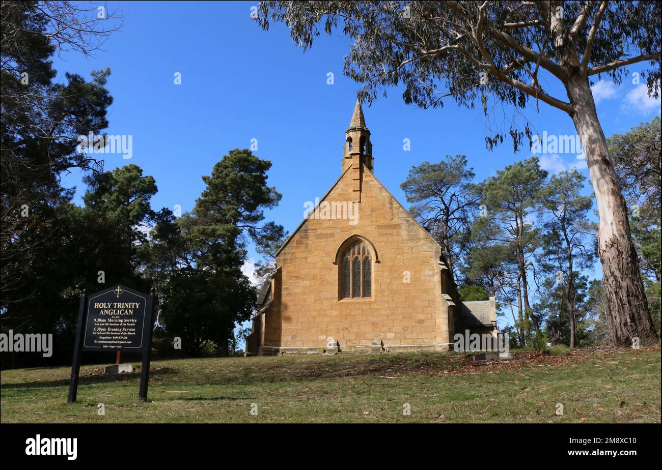 Berrima, New South Wales, Australia - 30 Aug 2022: The historic sandstone Holy Trinity Anglican Church, situated in a grove of eucalyptus trees. Stock Photo