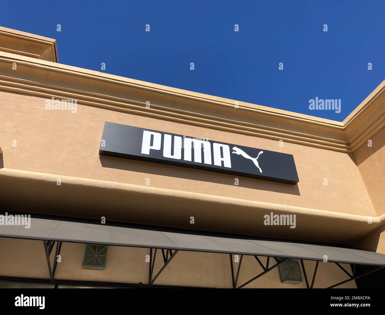 Puma sign, logo on the store facade at Desert Hills Premium Outlets ...