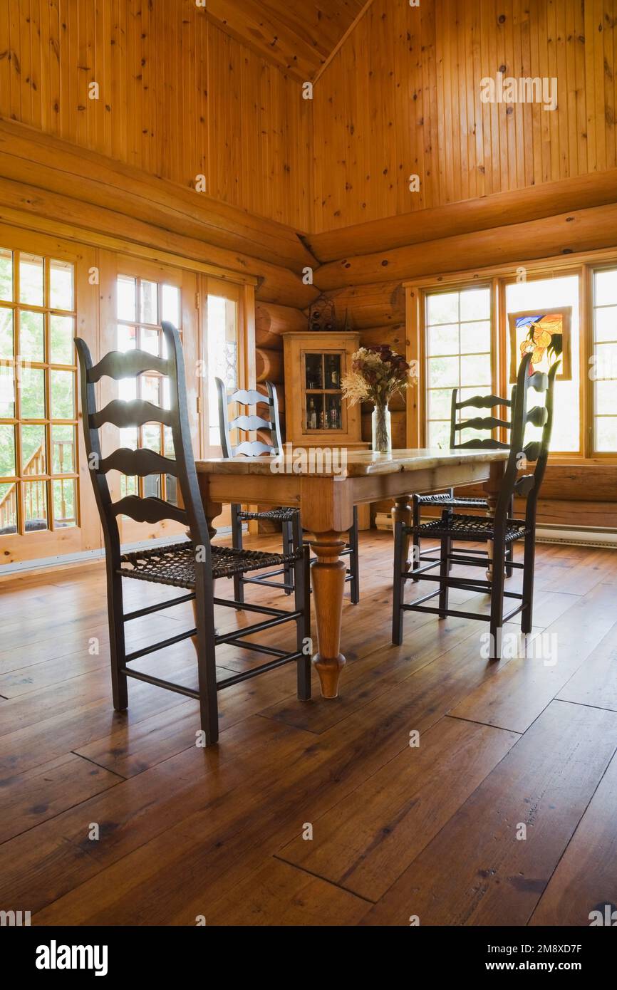 Antique pinewood dining table with high back woven rawhide seat chairs