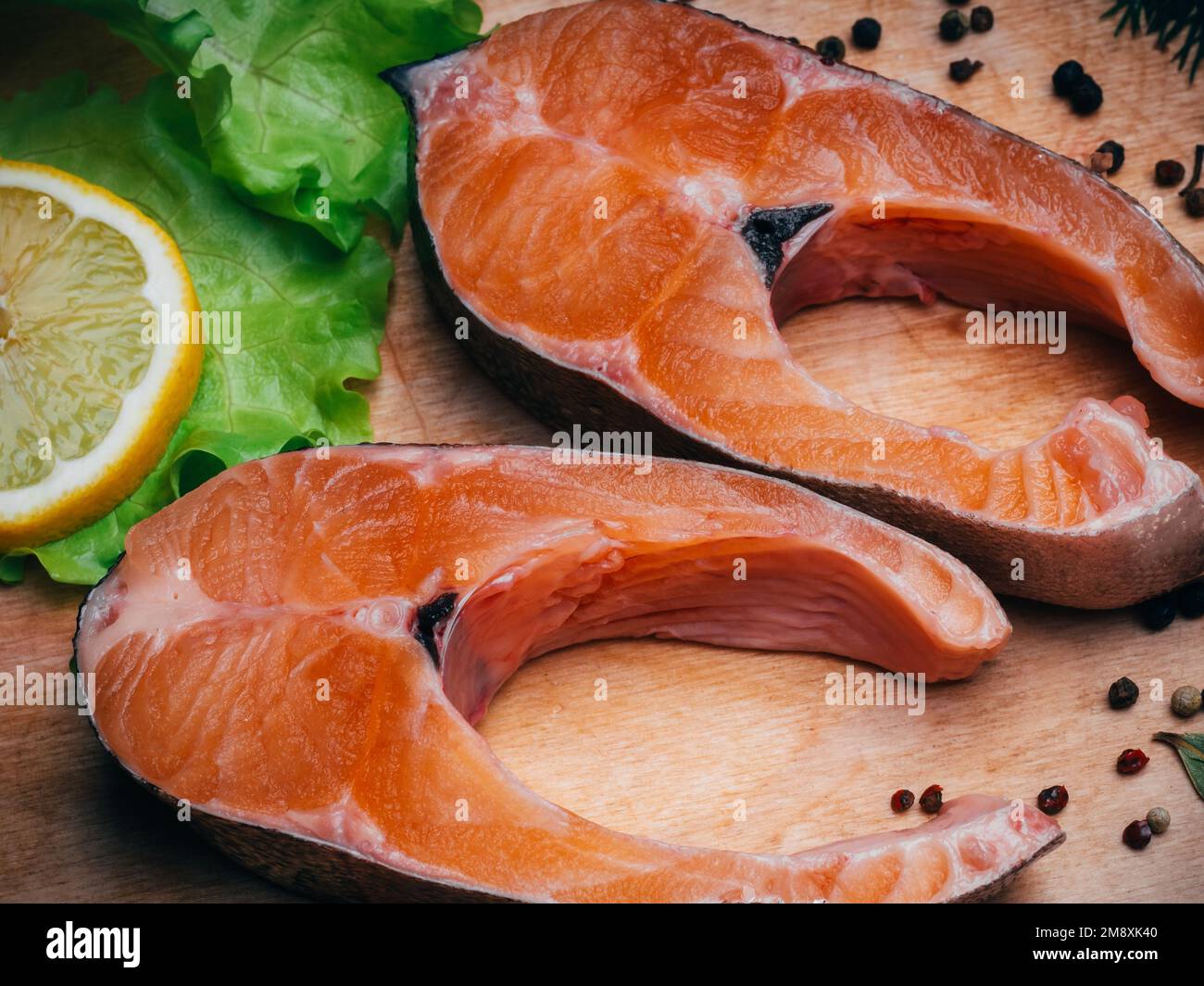 sliced pieces of raw trout fillet for a delicious diet. Fresh red fish close-up Stock Photo