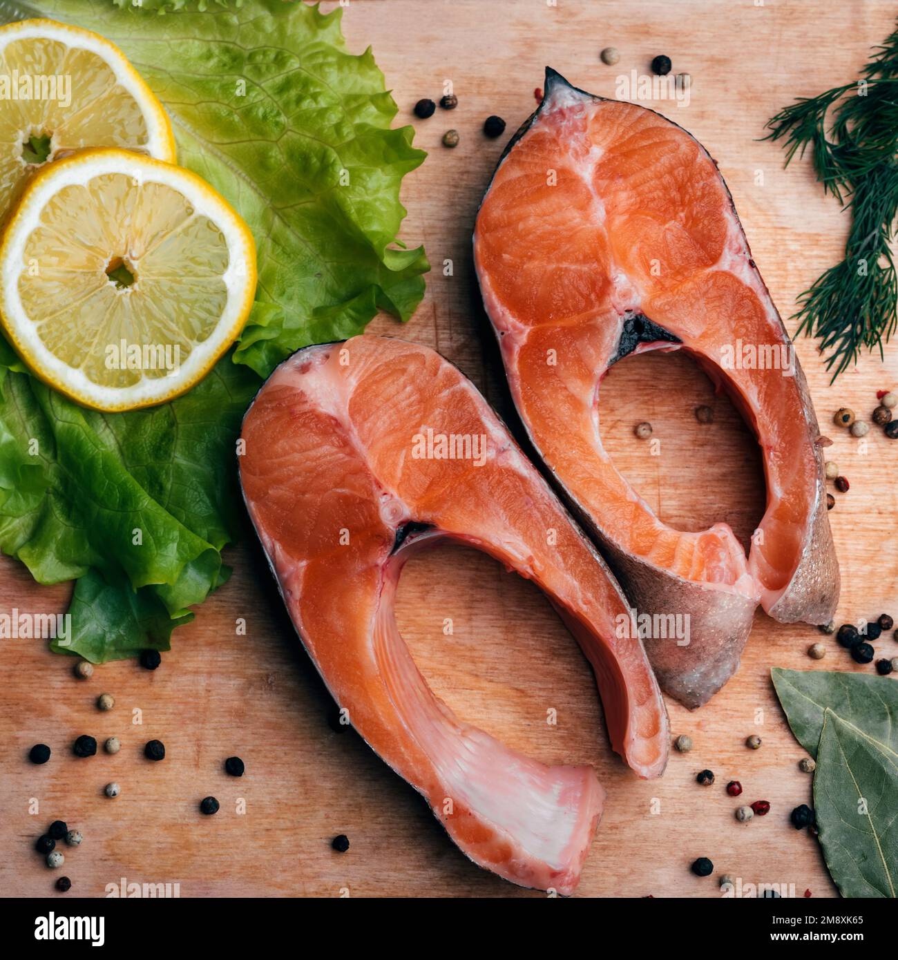 cut pieces of red fish on the Board close-up. Fresh trout fillet Stock Photo