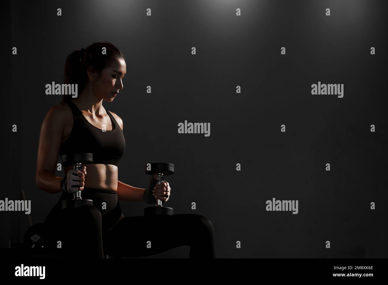 Mature Woman Exercising Biceps With Dumbbells In The Gym And Flexing  Muscles - Muscular Athletic Bodybuilder Fitness Model Doing Dumbbell  Concentratio Stock Photo - Alamy