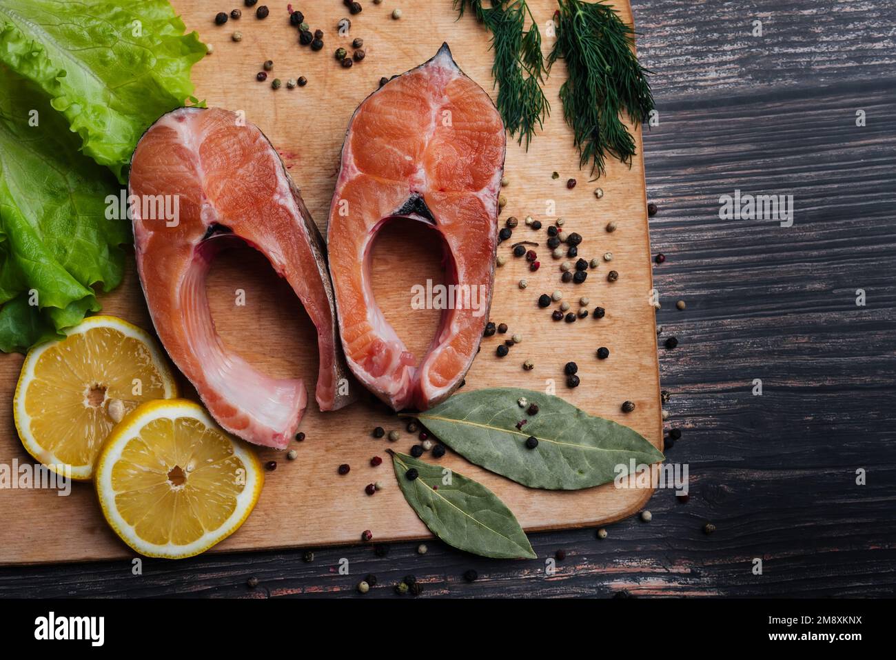 sliced pieces of raw trout fillet for a delicious diet. Fresh red fish close-up Stock Photo
