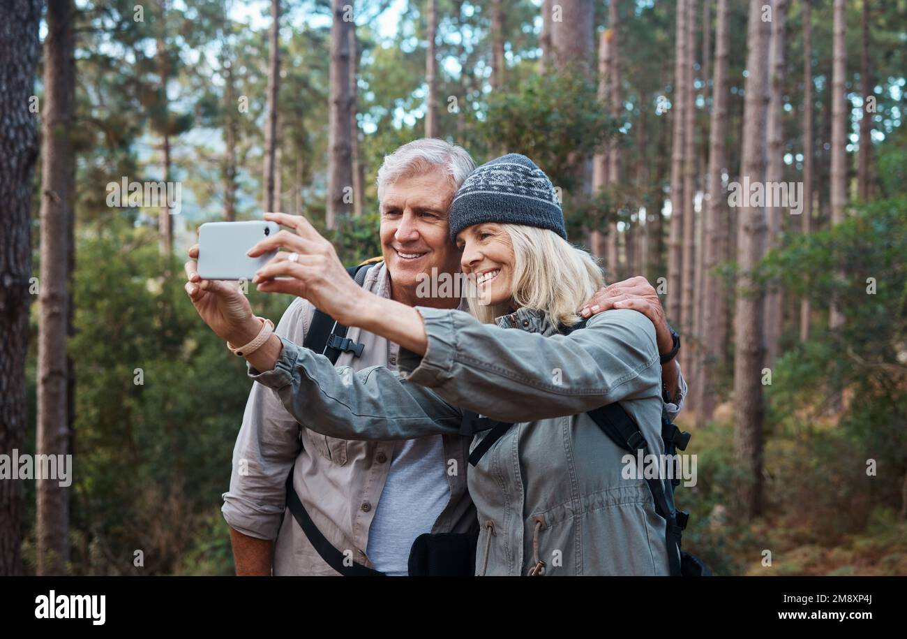 Another selfie about another adventure. a mature couple taking a selfie while out hiking together. Stock Photo
