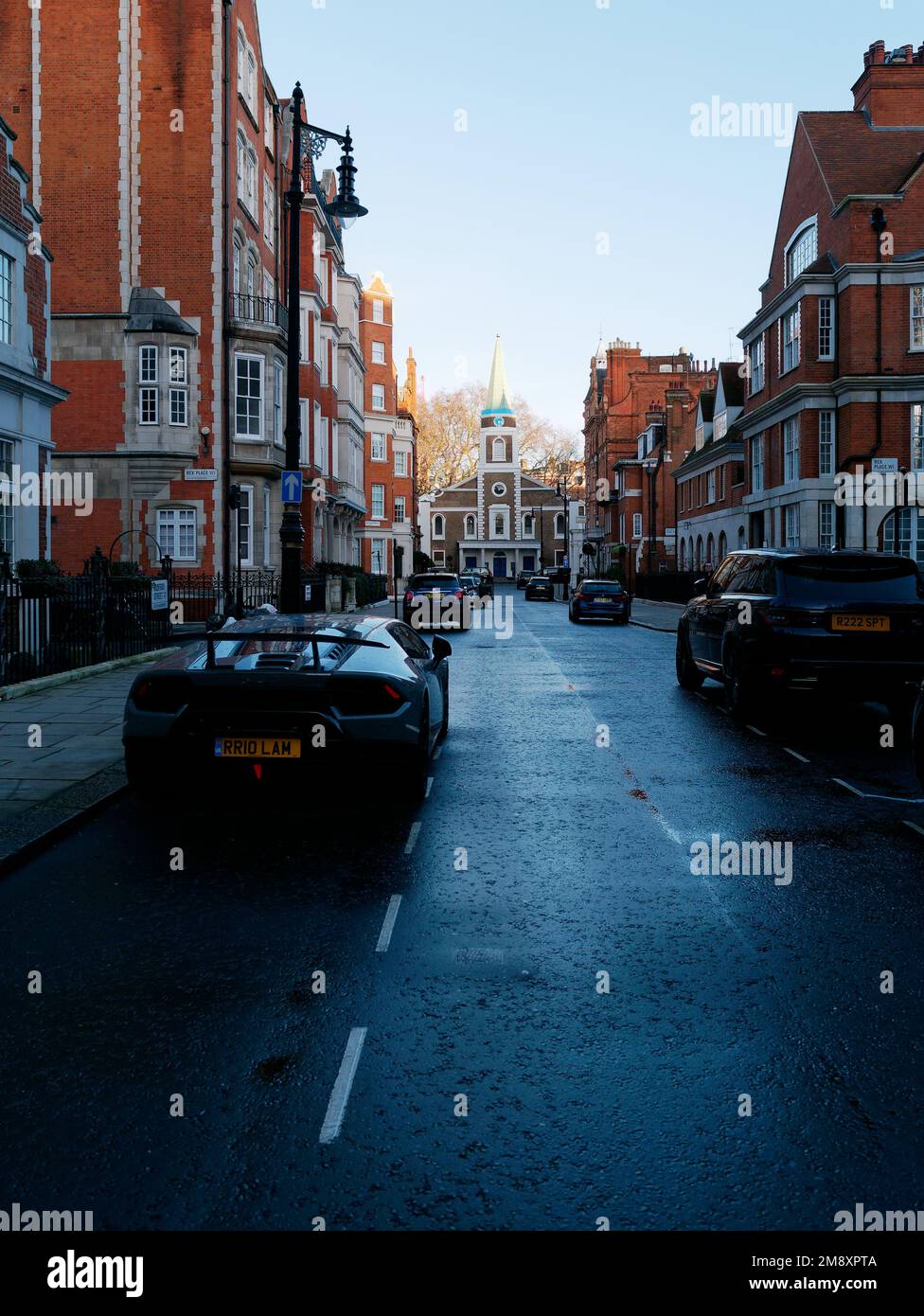 Aldford Street near Park Lane with a super car parked on the left and