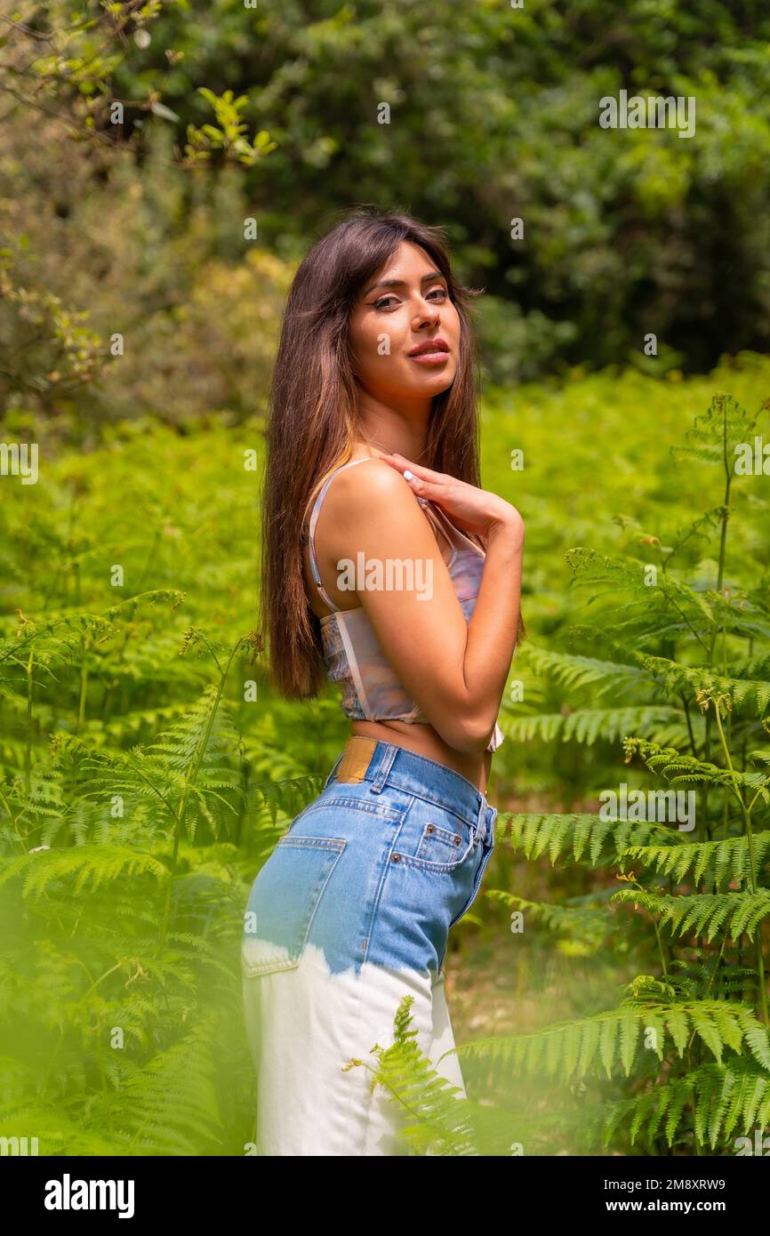 portrait-of-a-caucasian-girl-in-ferns-on-a-mountain-surrounded-by