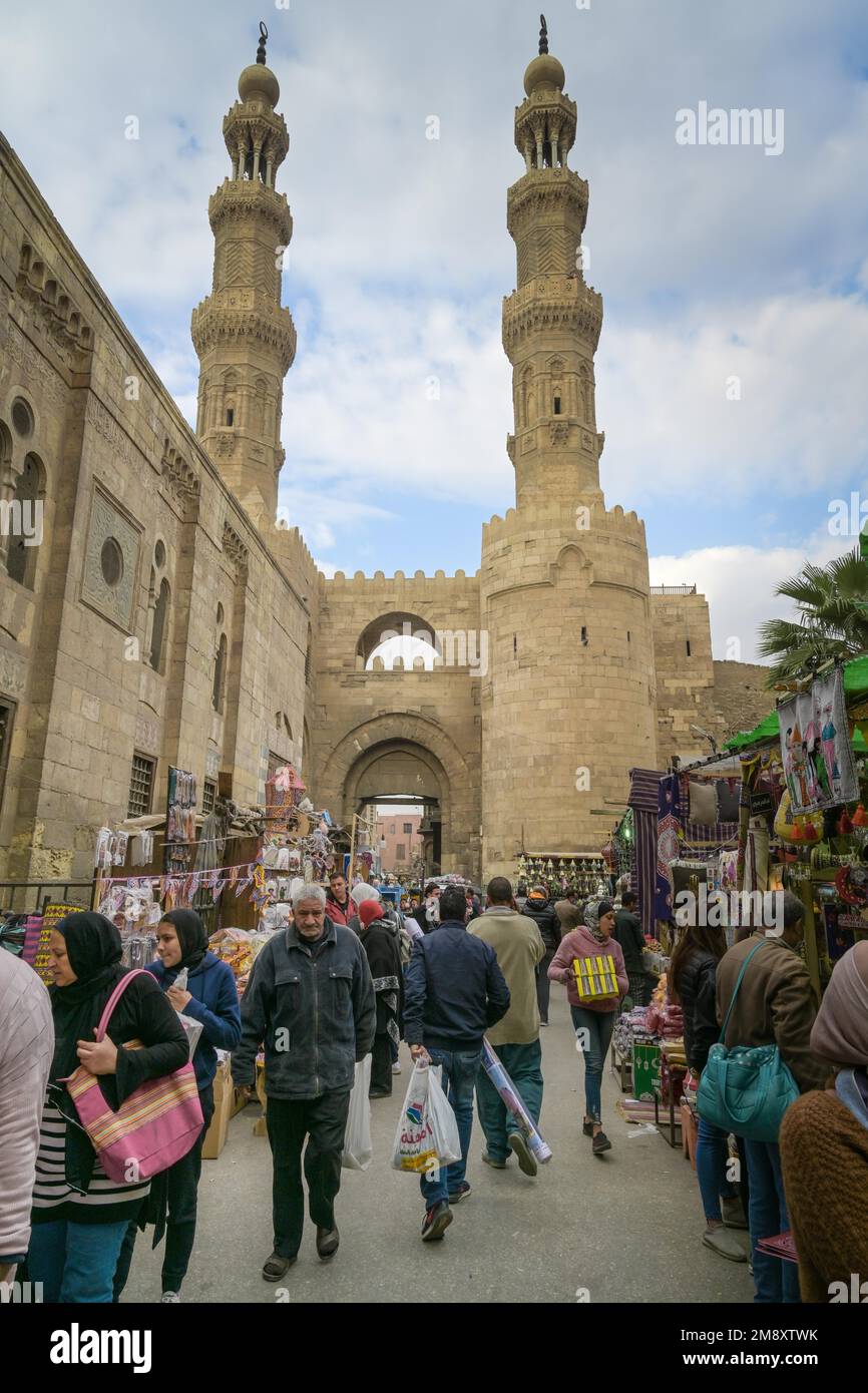 City gate, minarets, people, Khan el-Khalili bazaar, Old City, Cairo, Egypt Stock Photo