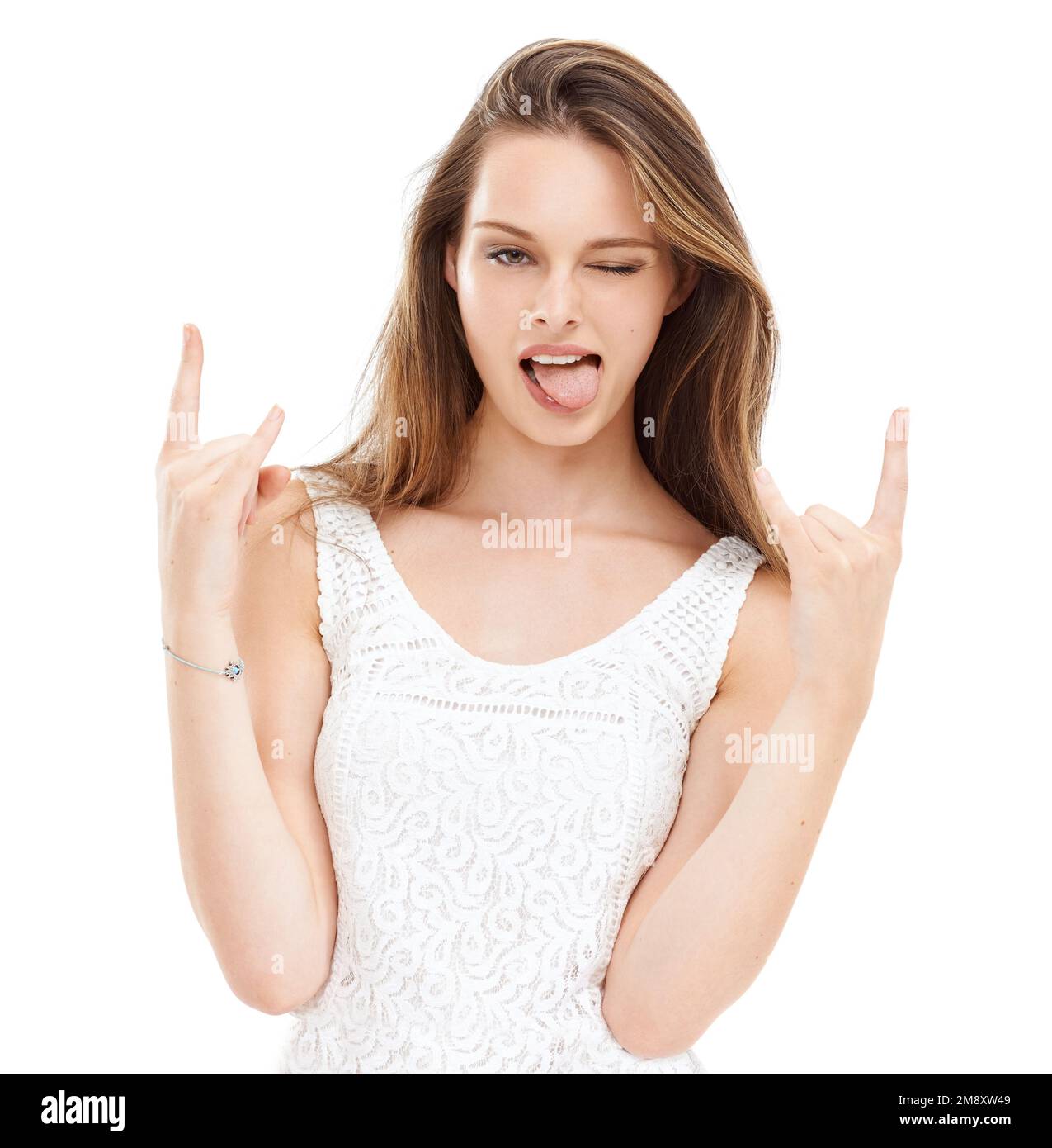 Tongue out, hands and woman with devil horns in studio for rock, punk