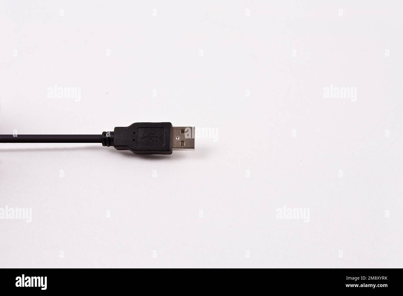 USB data cable with a path on a white background. Designed to connect