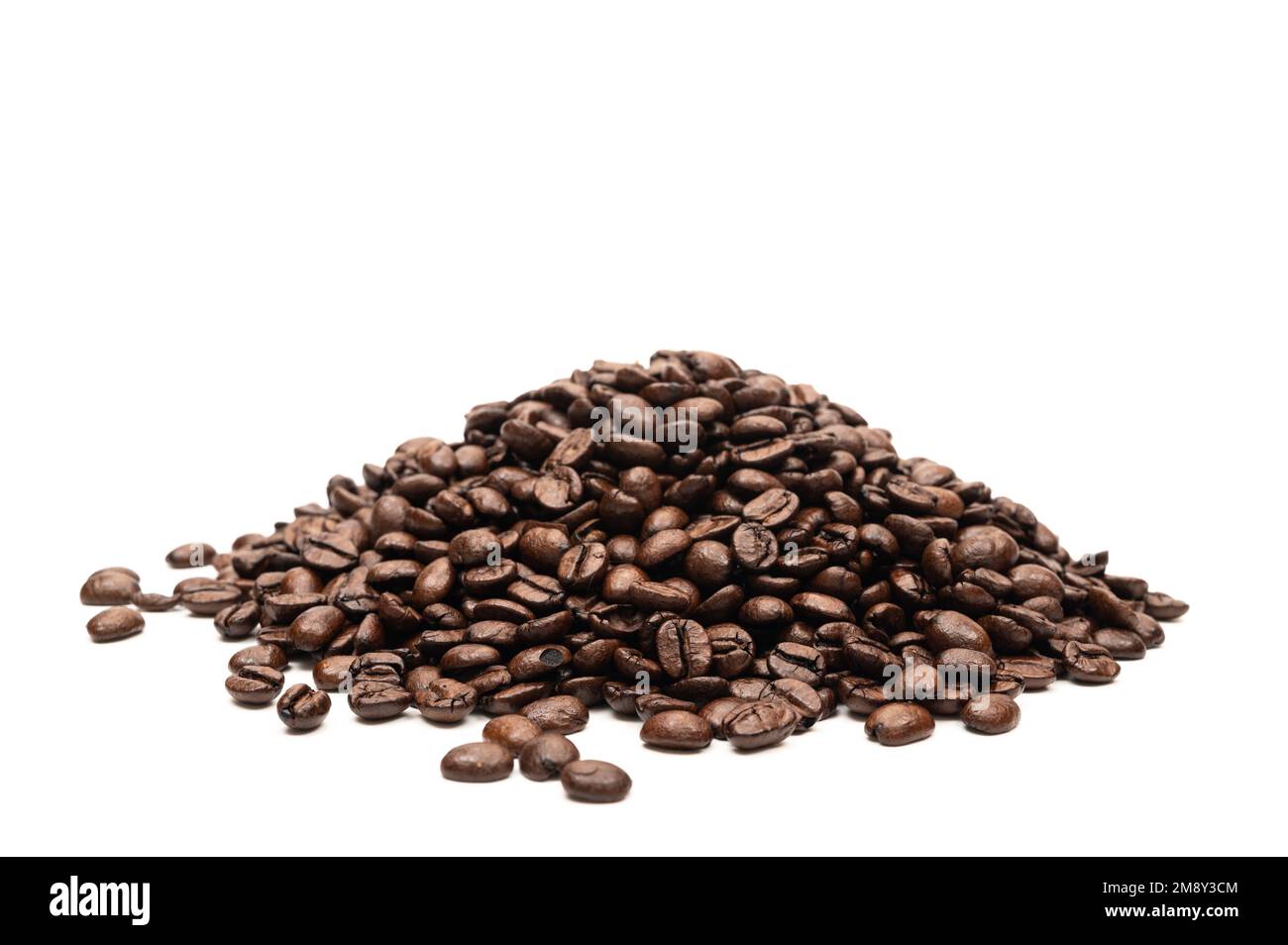 A pile of freshly roasted coffee beans. Stock Photo