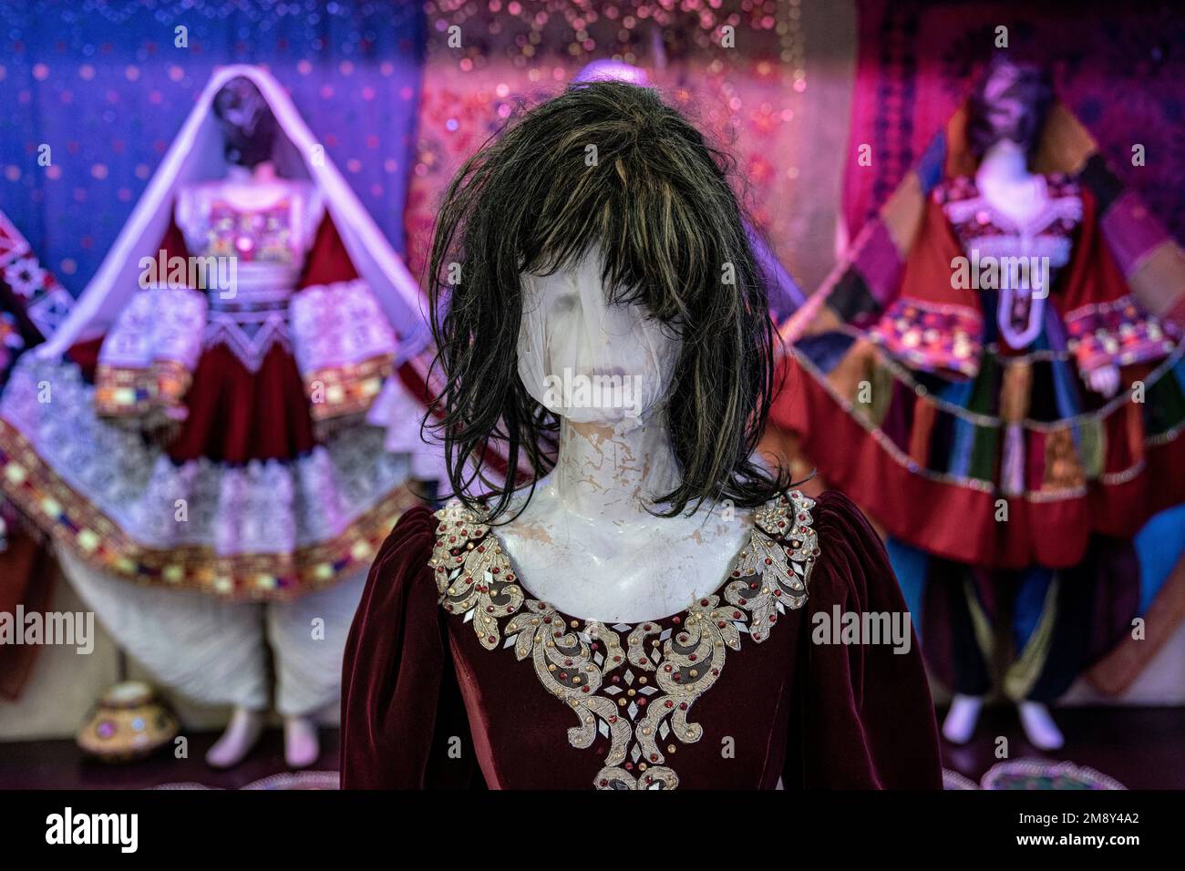 A mannequin's head is covered in a woman dress shop in Kabul, Afghanistan, Monday, Dec. 26, 2022