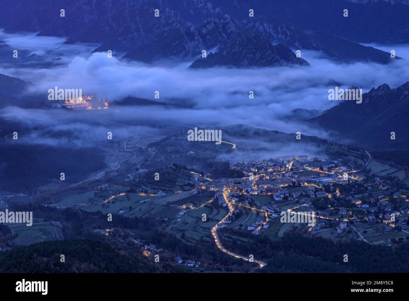 Sunrise in Vall de Lord valley with fog over the reservoir near Sant Llorenç de Morunys village. Seen from Port del Comte (Lleida, Catalonia, Spain) Stock Photo