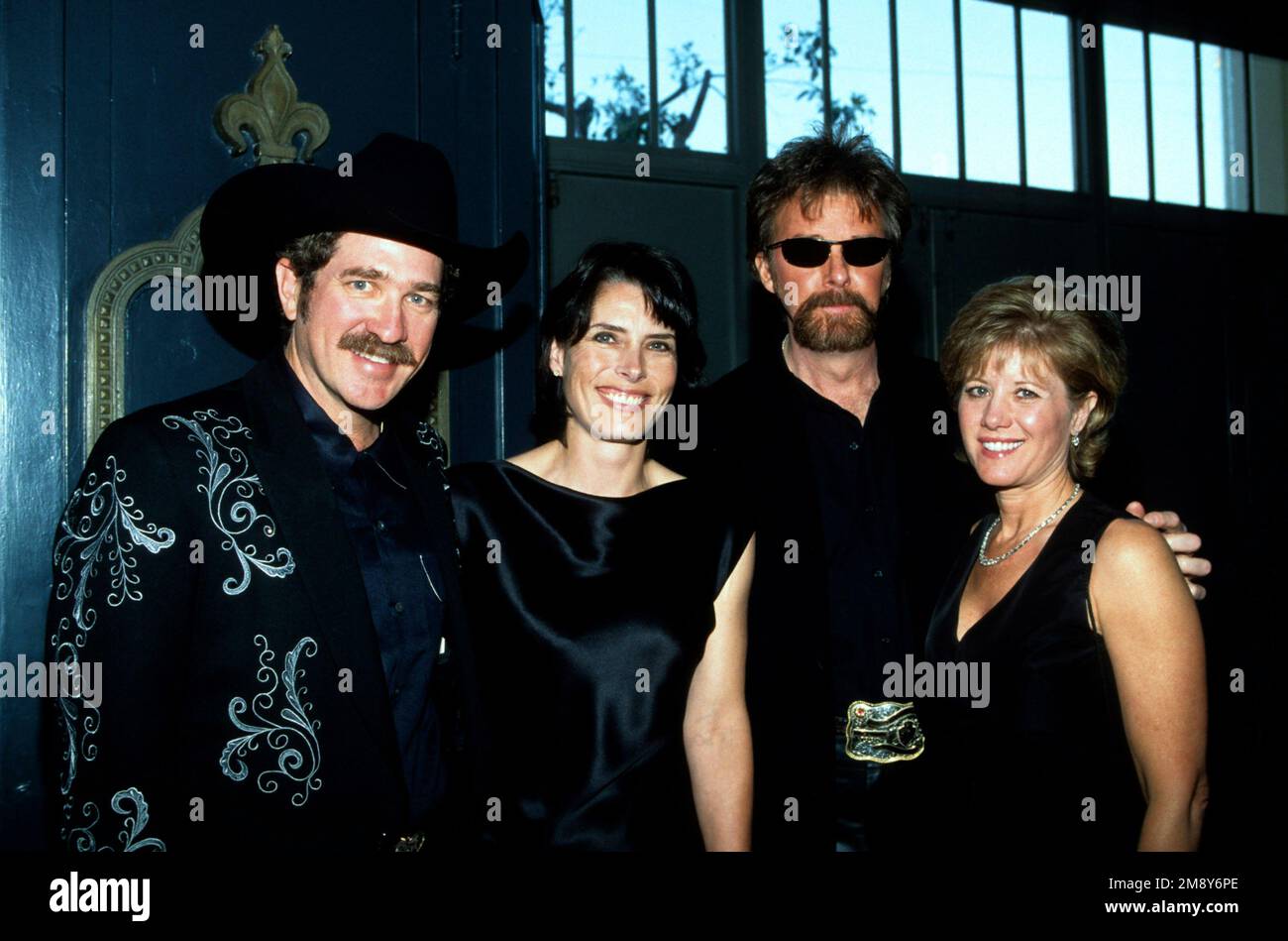 Brooks & Dunn & their wives backstage at the American Music Awards in