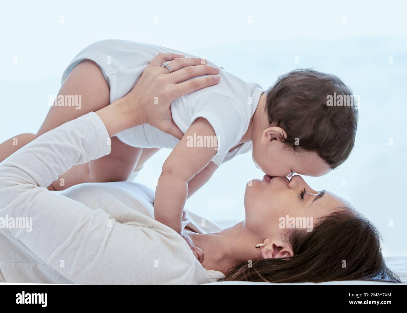 Cant stop kissing her. a young mother bonding with her baby at home. Stock Photo