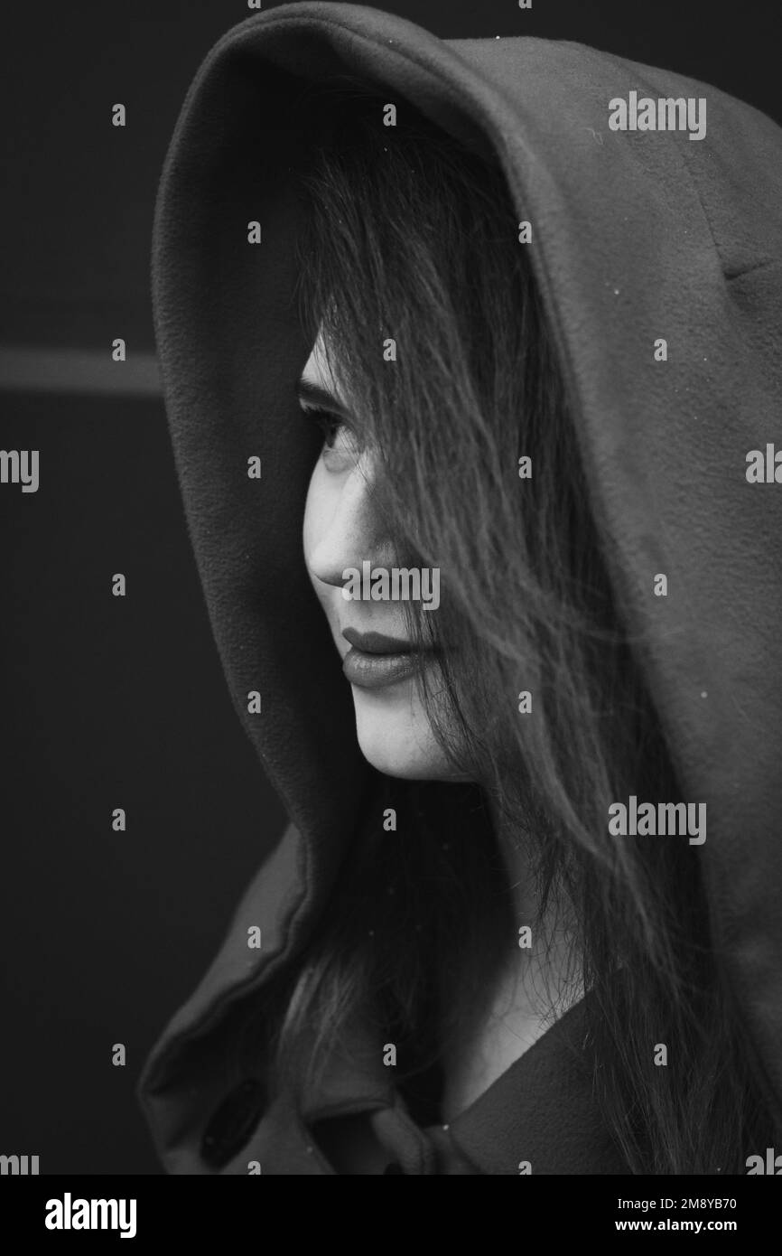 Close up pretty young woman wearing coat with hood monochrome portrait picture Stock Photo Alamy
