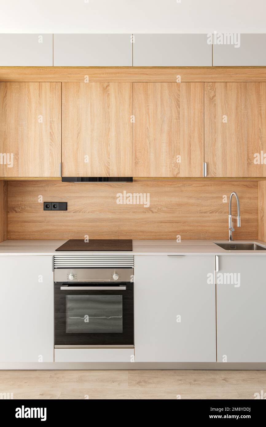 Closeup of piece of modular kitchen furniture made of light wood