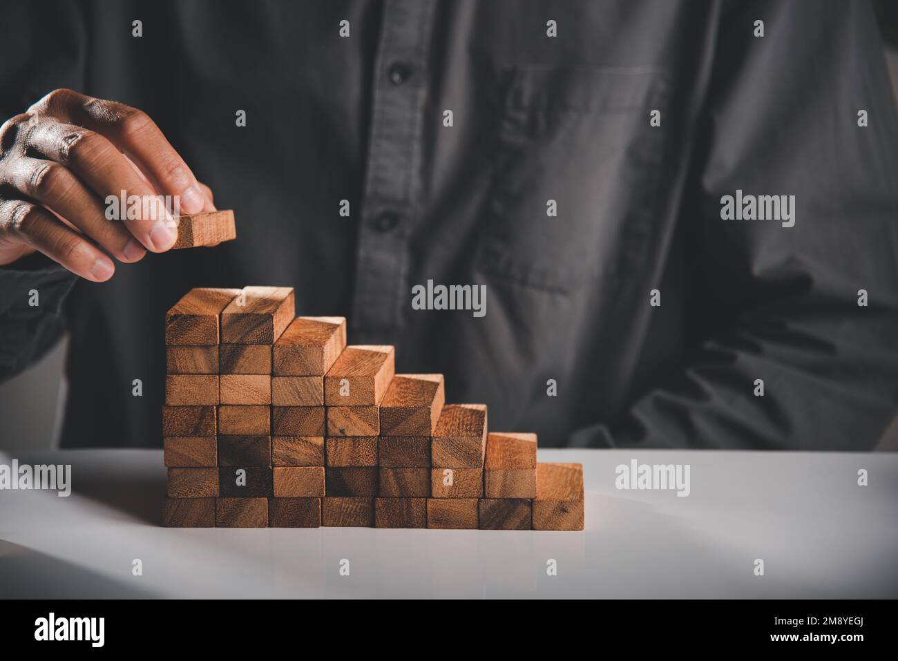 Business hand arranging put wooden block stacking step stair growth ...