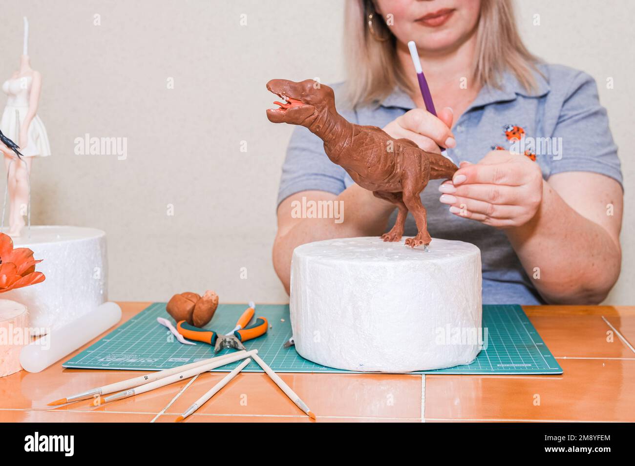 master in the modeling of figures from confectionery mastic Stock Photo