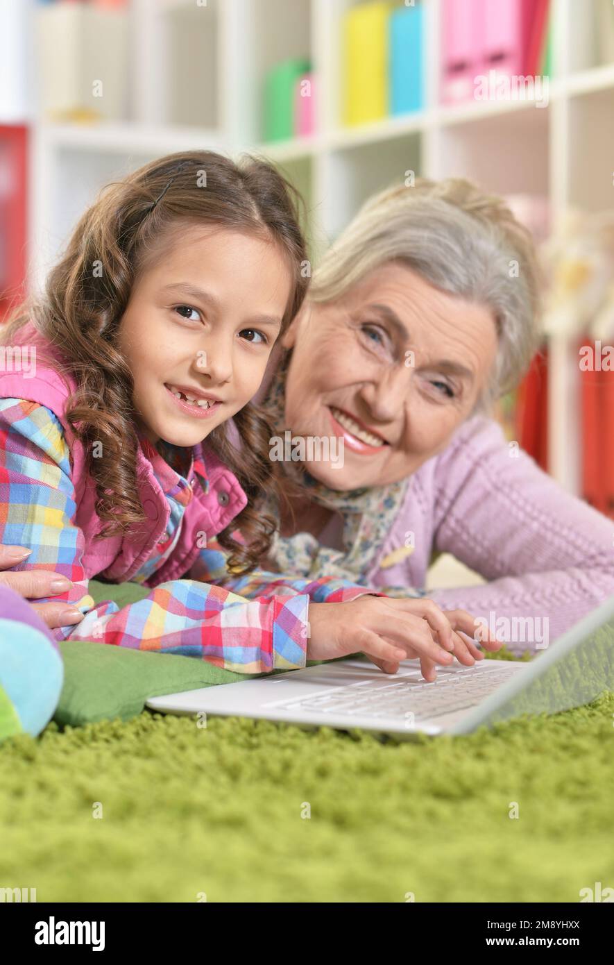 grandmother and daughter using modern laptop at home Stock Photo - Alamy