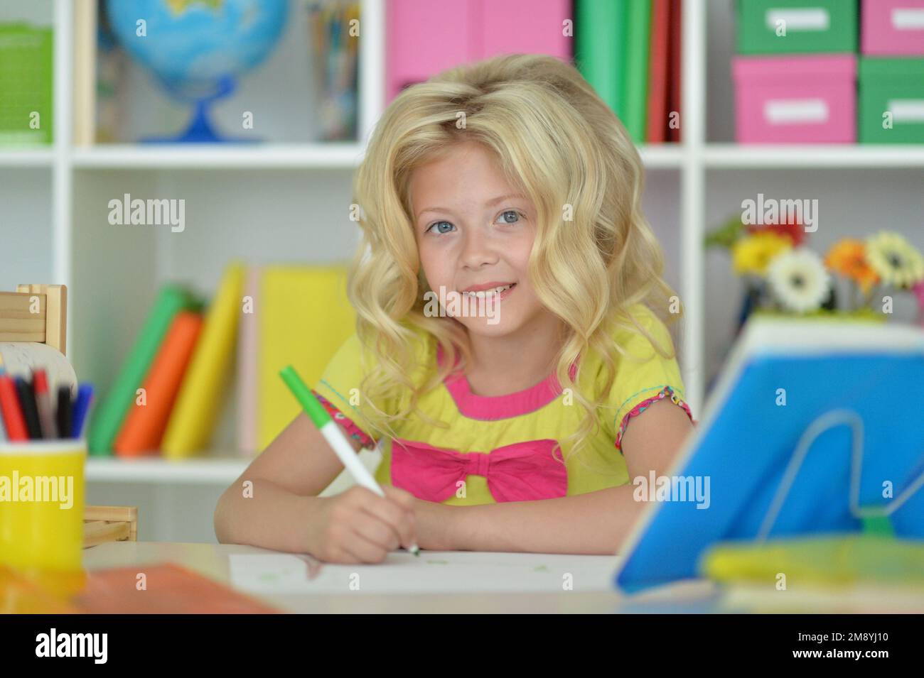 little girl studying at home at the table Stock Photo - Alamy