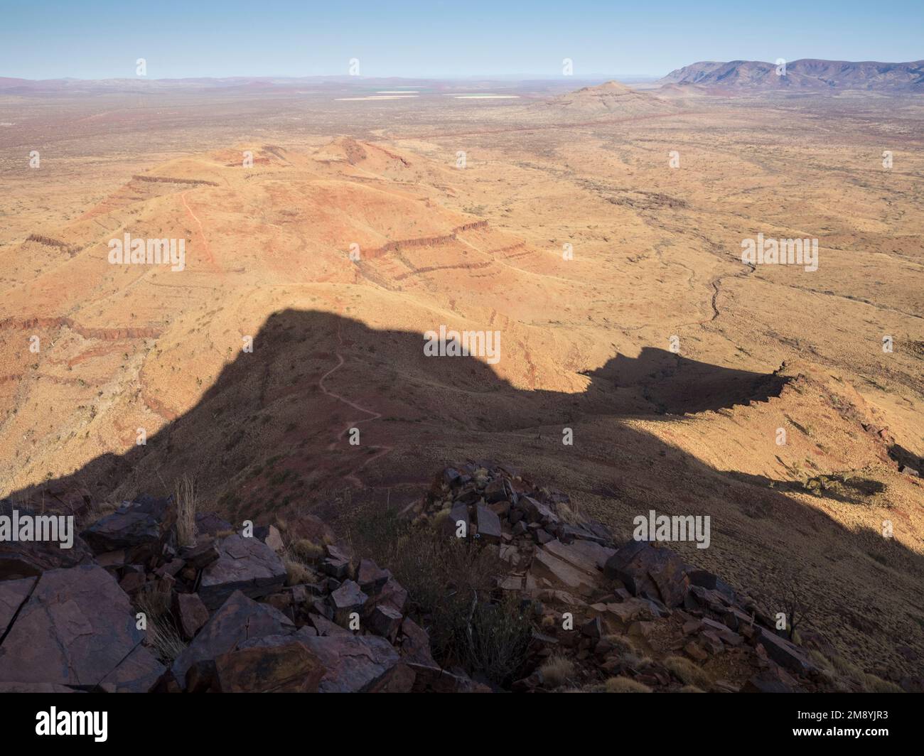 THe summit plateau throws a shadow over the track on the western ridge