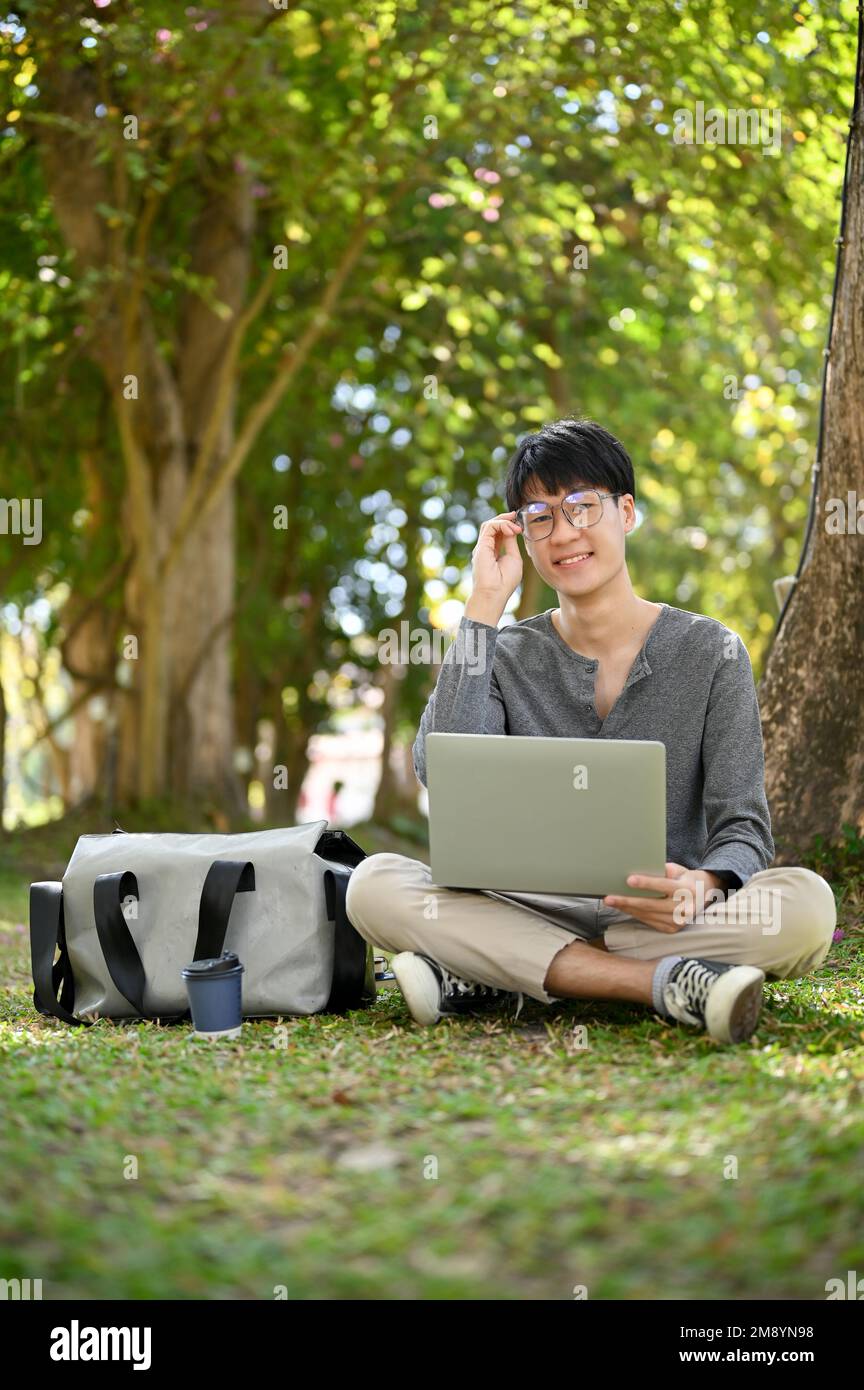 Portrait, Smart and happy young Asian male college student wearing ...