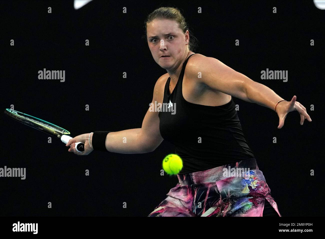 Jule Niemeier of Germany plays a forehand return to Iga Swiatek of Poland during their first round match at the Australian Open tennis championship in Melbourne, Australia, Monday, Jan