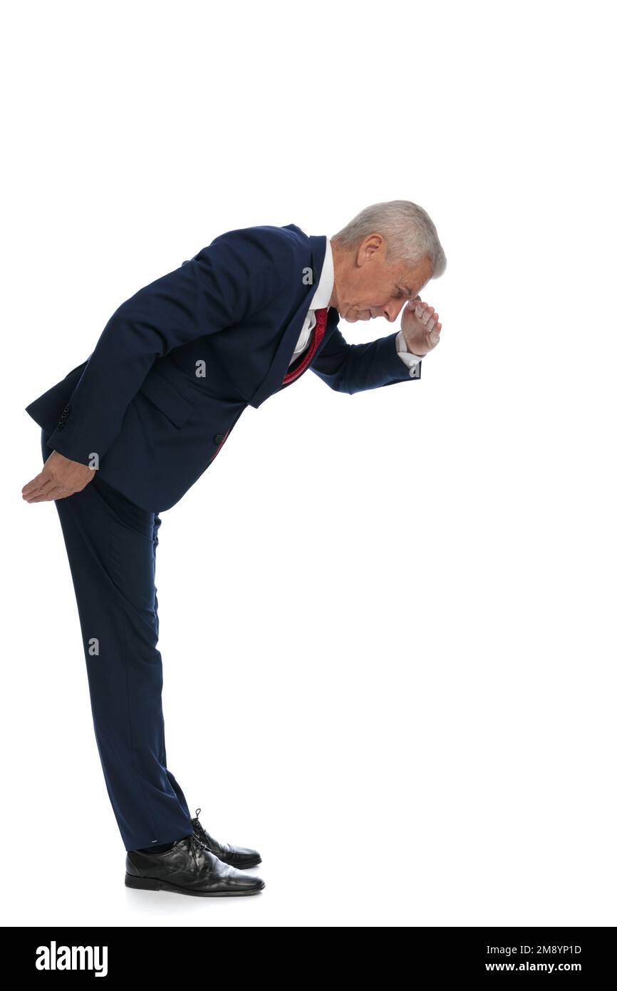 Full body picture and side view of an old businessman protecting his