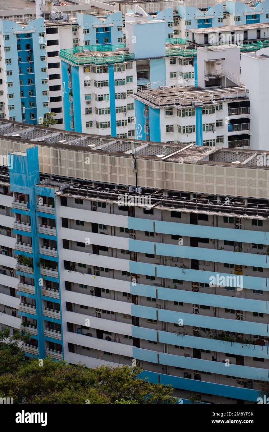 Vertical close up view of Singapore HDB housing painted in blue colour palette. Stock Photo