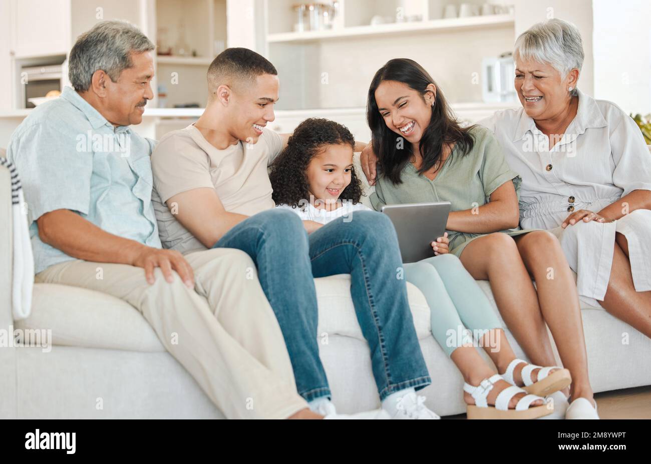 Days well planned. a beautiful family bonding on a sofa at home. Stock Photo