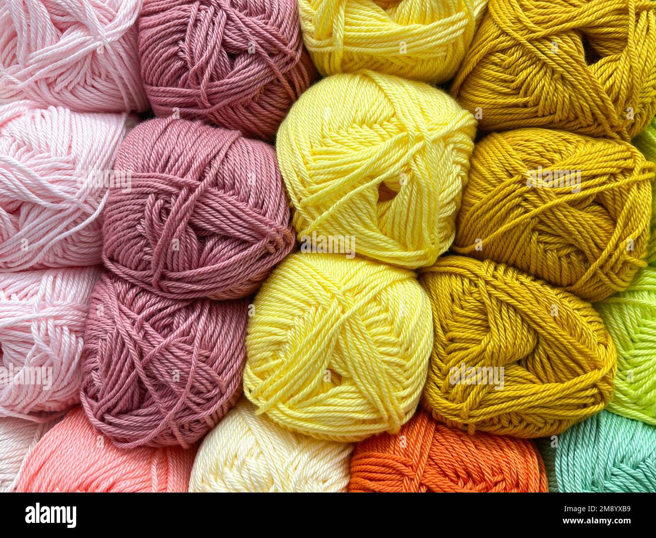 Colored yarn balls. The colors of the rainbow. All colors. Yarn for