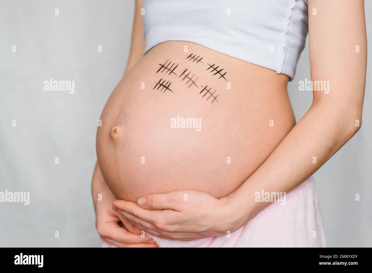 belly of a pregnant girl with painted paints for a period of pregnancy Stock Photo Alamy