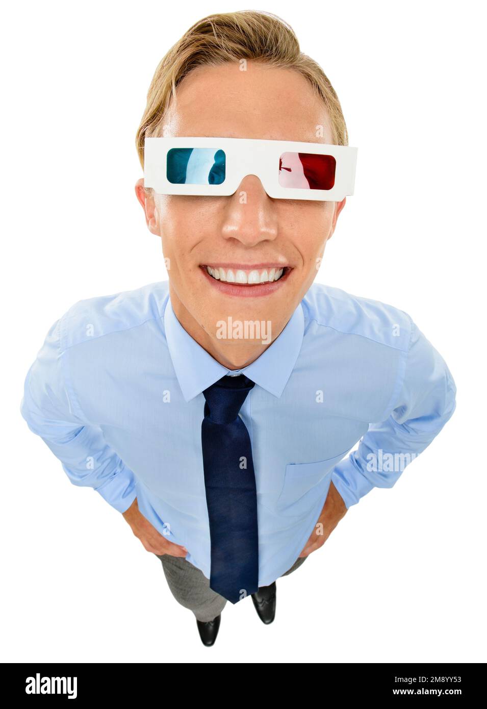 Get a different view of things. a handsome young businessman standing alone in the studio and wearing 3d glasses. Stock Photo