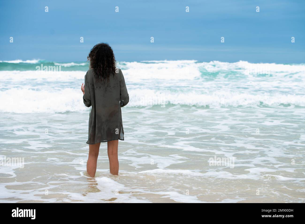 Woman watching waves hi-res stock photography and images - Alamy