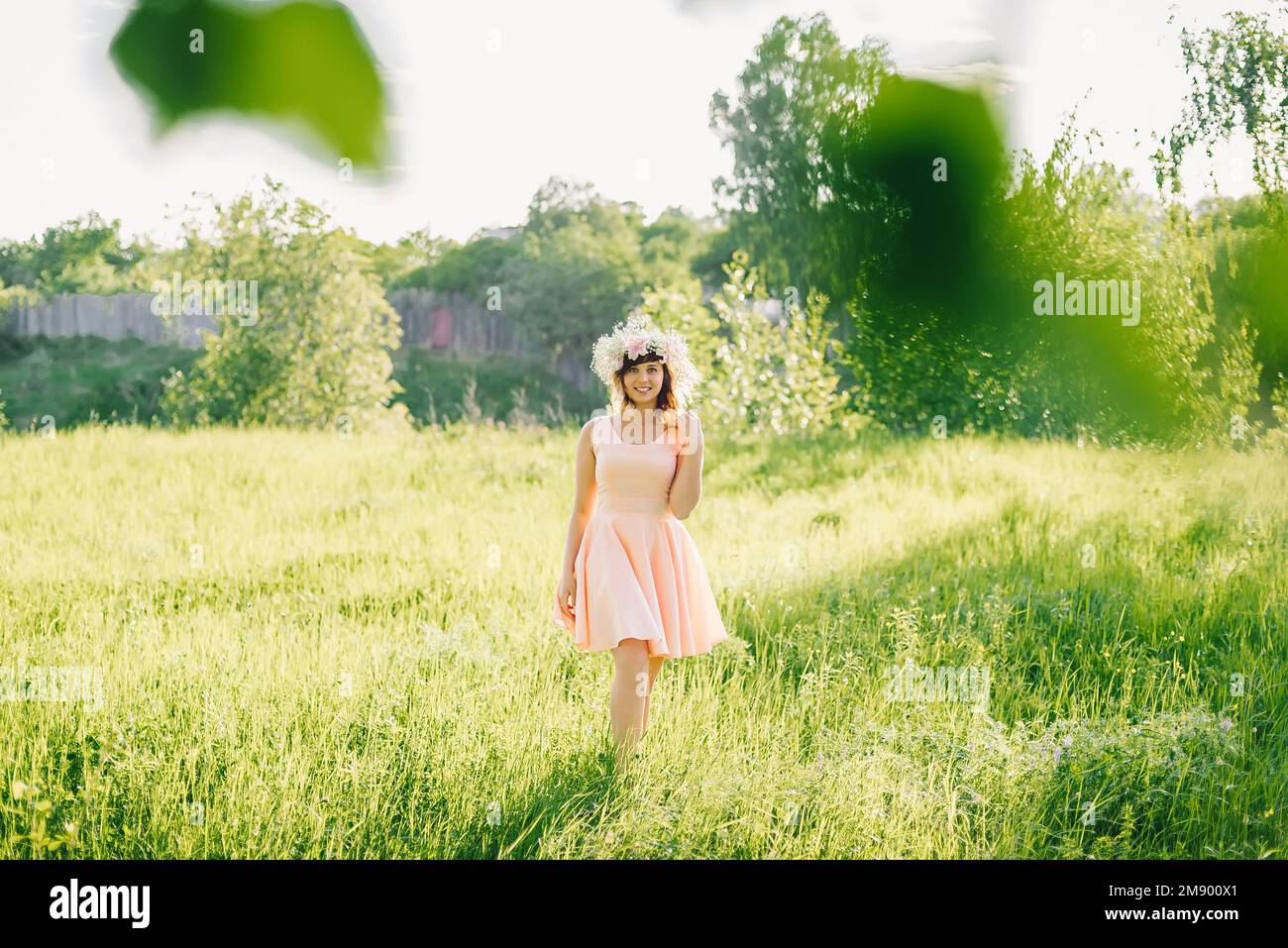 beautiful girl in a dress of Caucasian appearance with a wreath on her ...