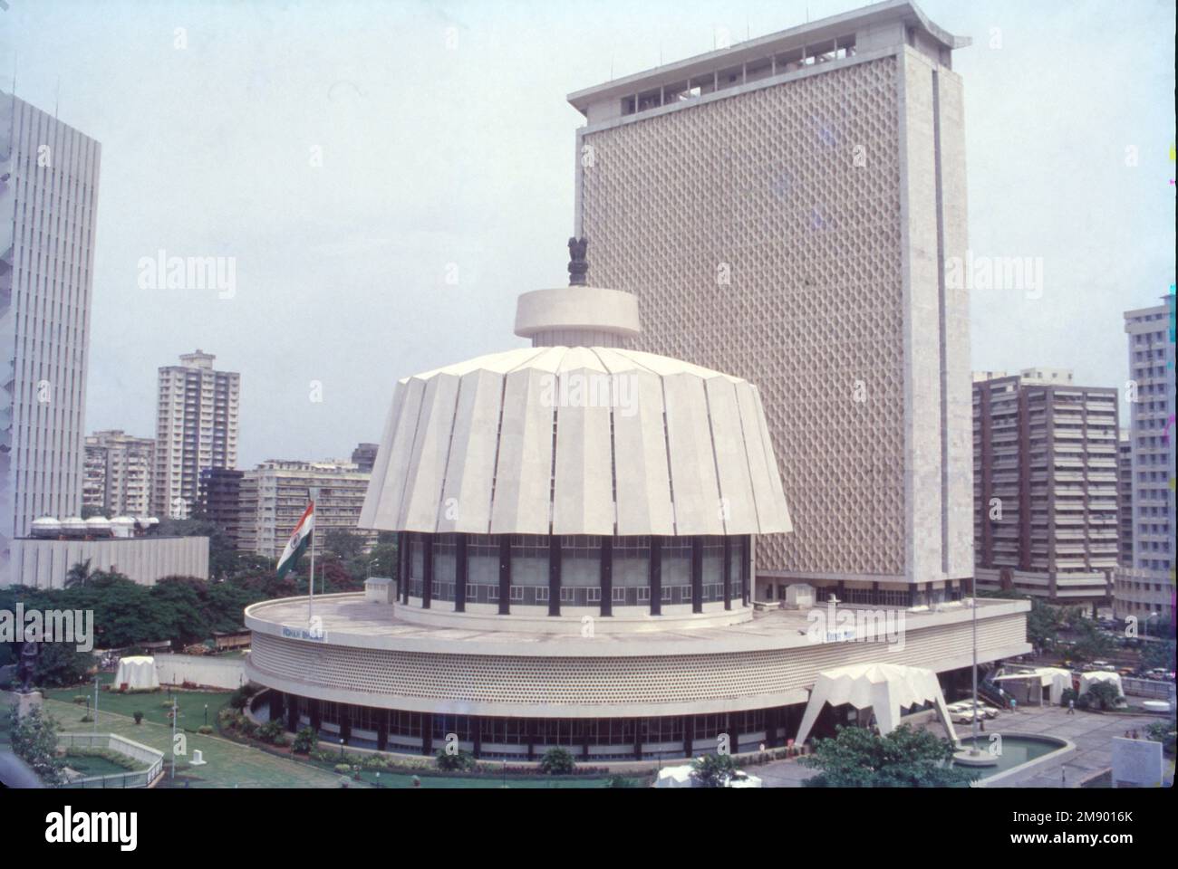 The Mahārāṣṭra Vidhāna Sabhā or the Maharashtra Legislative Assembly is the lower house of the legislature of the Indian state of Maharashtra. It is situated in the Nariman Point area of South Mumbai in the capital Mumbai. The honeycomb like towering edifice with a circular building housing the two houses of the Maharashtra state legislature. Stock Photo