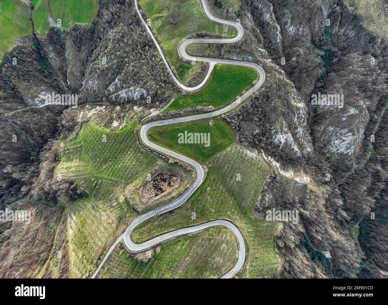mountain-road-with-hairpin-bends-in-bird-s-eye-view-drone-stock-photo