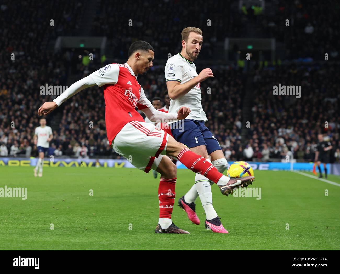 L-R William Saliba of Arsenal and Tottenham Hotspur's Harry Kane in action during the English Premier League soccer match between Tottenham Hotspur an Stock Photo
